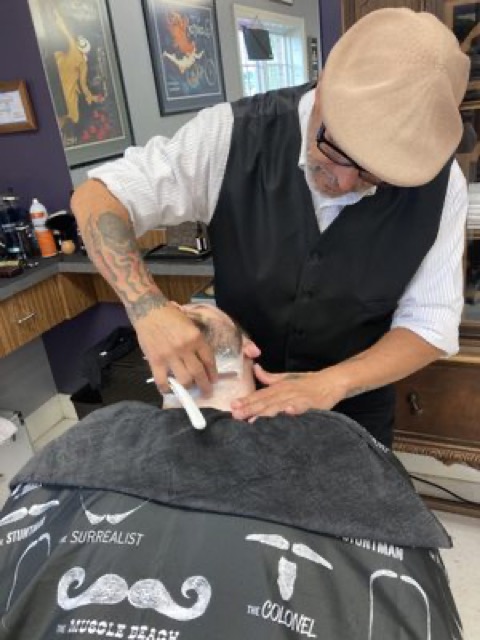 Detailed low taper fade with textured top, finished cut